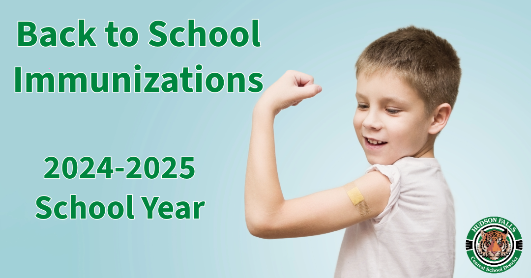 Photo of a young boy flexing with a band aid on his arm for Immunization reminder