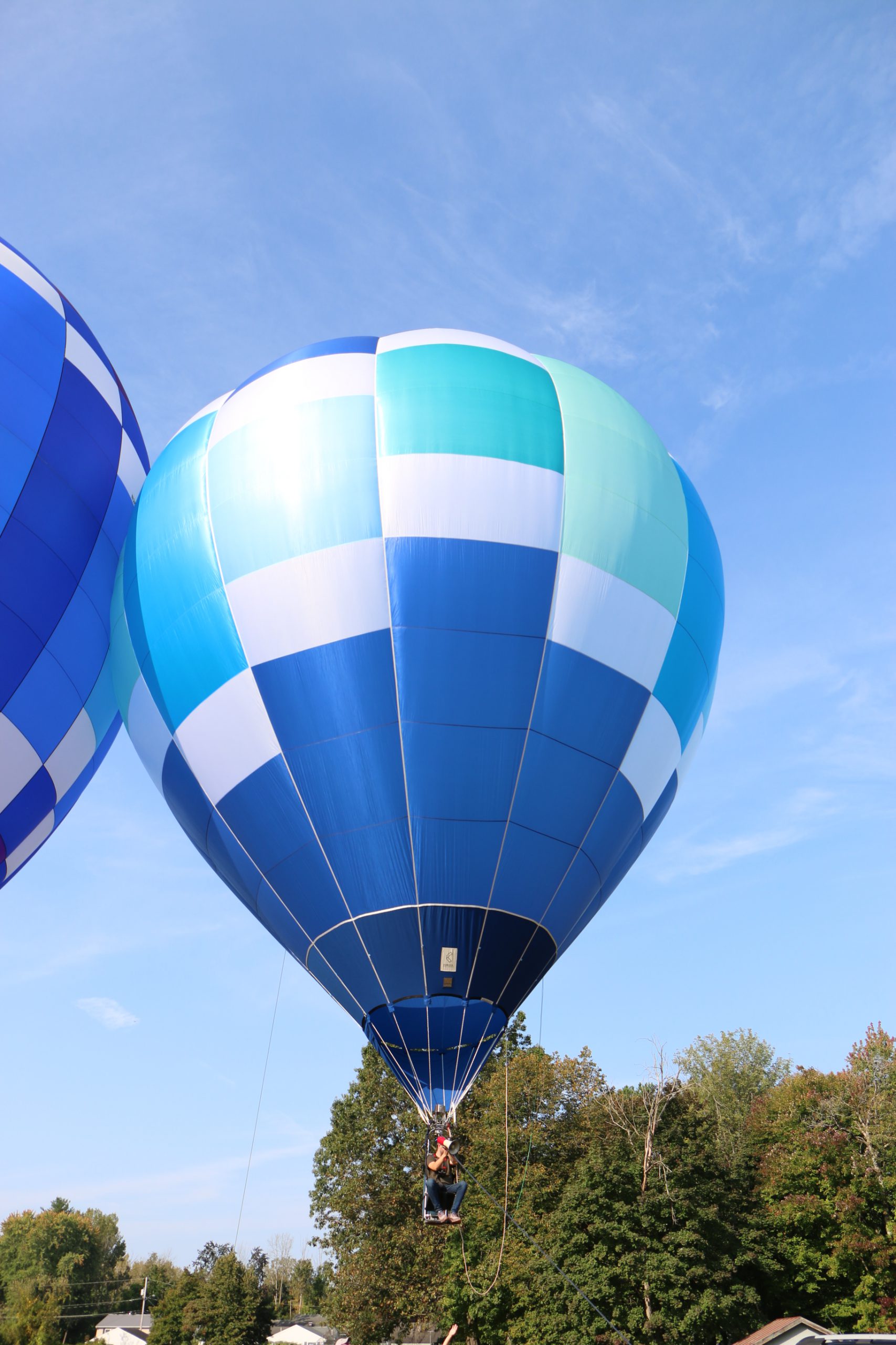 photo of hot air balloon slightly off the ground