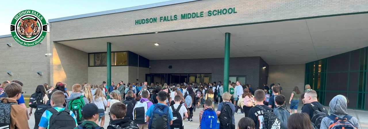 Photo of a large number of students entering the front entrance of the MS