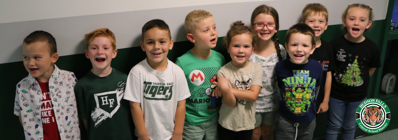 group photo of Kindergarten students wearing green and white for tiger Tuesday