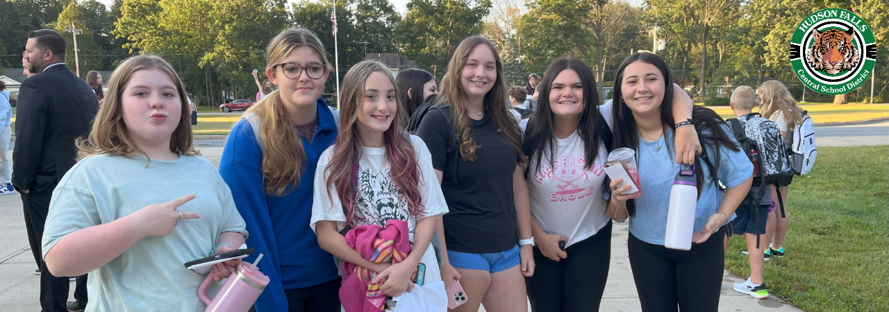 Group photo of MS students in front of the school