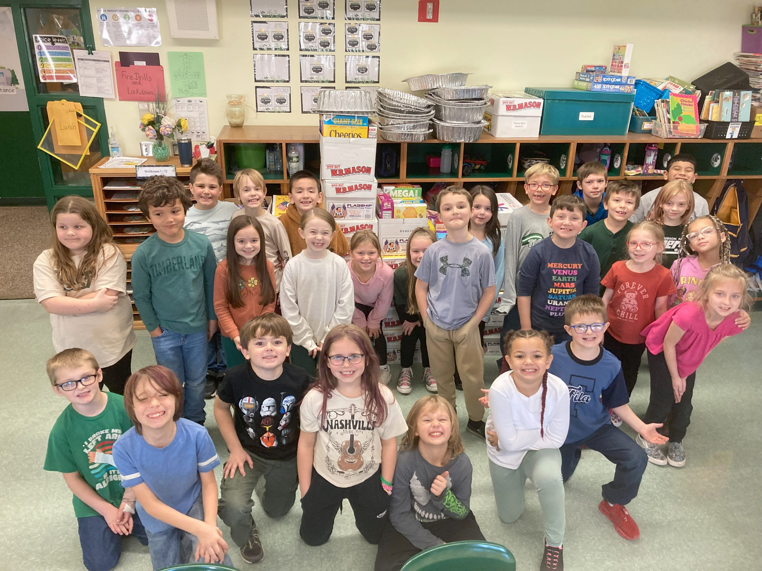 Photo of a group of Primary school students who assisted in the Thanksgiving food drive