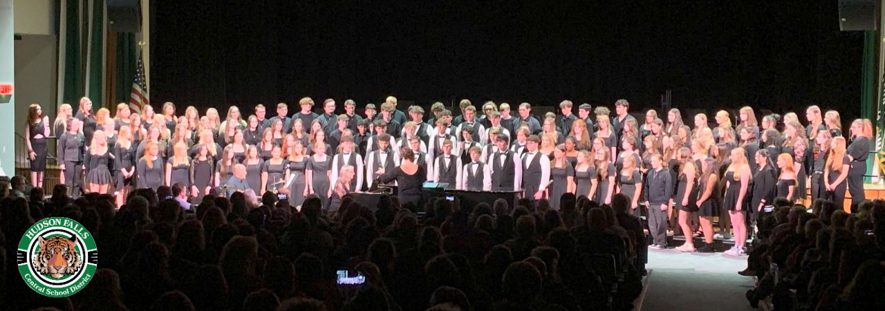 Photo of the High School choir singing at the Winter concert